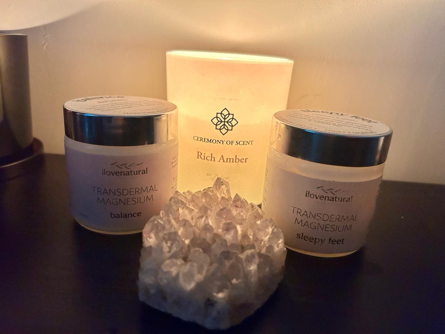 Magnesium cream beside a crystal on a soft cloth
